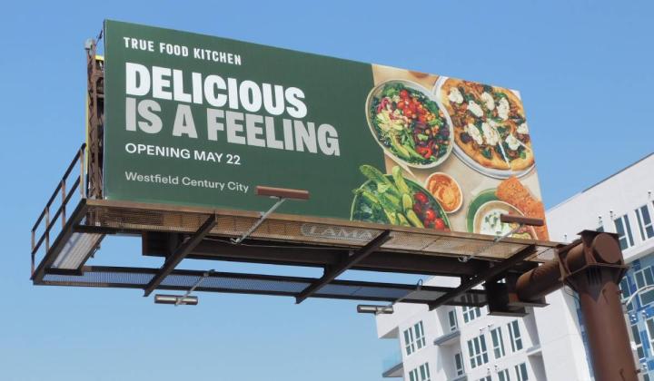 A billboard showcasing True Food Kitchen's new marketing materials. 